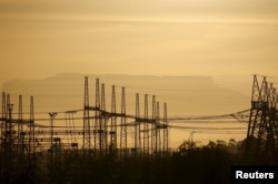 Wires carry electricity from a South African nuclear plant near Cape Town, Nov. 28, 2015.