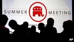 People talk before the start of the meeting of the standing committee on rules at the Republican National Committee summer meeting in Nashville, Tenn., Aug. 24, 2017. 