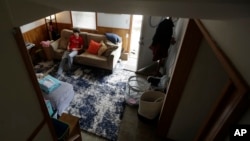 In this Thursday, March 19, 2020, photo, Jack Keenan, 16, plays video games at his home in San Francisco. California's Bay Area has been shut down for more than a week, the first region of America to order its residents to stay home and work remotely.