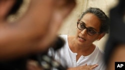 FILE - Booker Prize-winning novelist Arundhati Roy speaks during a meeting protesting the killing of freelance journalist Hem Chand Pandey in a police encounter, in New Delhi, India. 