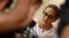 FILE - Booker Prize-winning novelist Arundhati Roy speaks during a meeting protesting the killing of freelance journalist Hem Chand Pandey in a police encounter, in New Delhi, India, July 7, 2010.