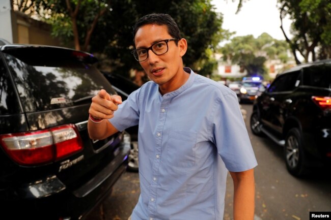 FILE - Indonesian vice president candidate Sandiaga Uno gestures as he walks in front of his house in Jakarta, Indonesia.