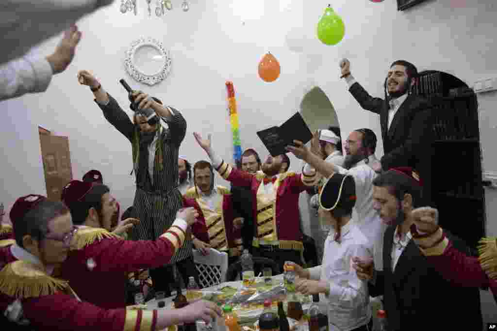 Ultra-Orthodox Jews celebrate during the Jewish holiday of Purim, in the Mea Shearim ultra-Orthodox neighborhood of Jerusalem.