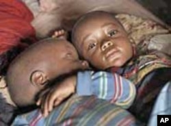 Twins Sao and Jinna at home in Kailahun, Sierra Leone. Several of their siblings were stillborn or died in infancy