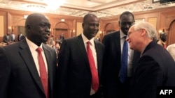 Members of South Sudan's rebel delegation talk with US Envoy to Sudan and South Sudan Donald E. Booth (R) on Jan. 4, 2014 during talks in Addis Ababa to try to broker a ceasefire between government and opposition forces.
