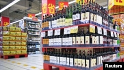 Shelves displaying discounted wines are seen at a supermarket in Shanghai, China, Oct. 29, 2015. 