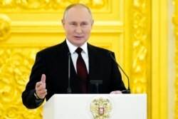 Russian President Vladimir Putin speaks in the Kremlin, in Moscow, Russia, Dec. 1, 2021.