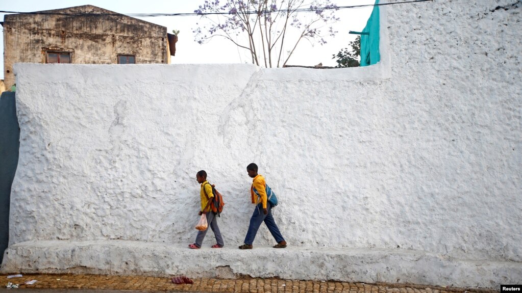 Students walk within the walled city of Harar, Ethiopia, Feb. 24, 2017.