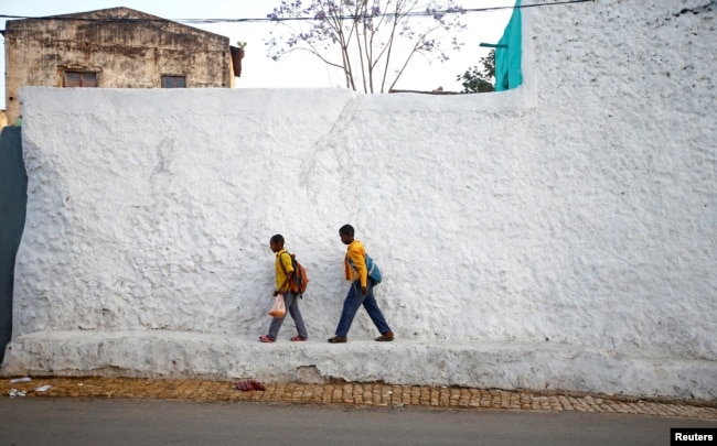 FILE - Students walk within the walled city of Harar, Ethiopia, Feb. 24, 2017.