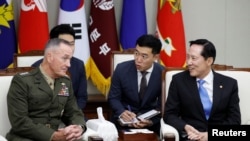 U.S. Chairman of the Joint Chiefs of Staff Gen. Joseph Dunford talks with South Korean Defence Minister Song Young-moo during their meeting at the Defence Ministry in Seoul, South Korea, Aug. 14, 2017. 