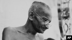 Mahatma Gandhi in a photo from a period album collected by AP reporter James A. Mills, ca. 1931.