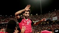 Egypt's Mohamed Salah celebrates defeating Congo during the 2018 World Cup group E qualifying soccer match at the Borg El Arab Stadium in Alexandria, Egypt, Sunday, Oct. 8, 2017. Egypt won 2-1.