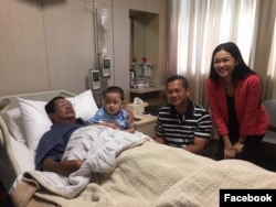 Hun Sen is pictured with his children and grandson during his hospital stay.