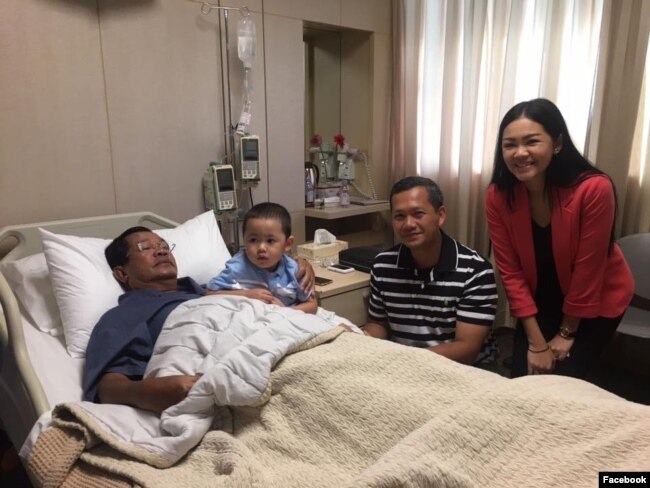 Hun Sen is pictured with his children and grandson during his hospital stay.