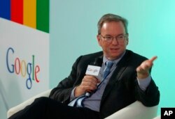 FILE - Eric Schmidt, Executive Chairman of Google, speaks during a session with students at the Chinese University of Hong Kong, in Hong Kong, Nov. 4, 2013.