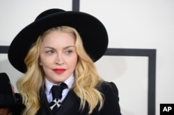 Madonna arrives at the 56th annual GRAMMY Awards at Staples Center on Jan. 26, 2014, in Los Angeles.