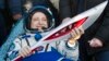 International Space Crew Return Olympic Torch to Earth