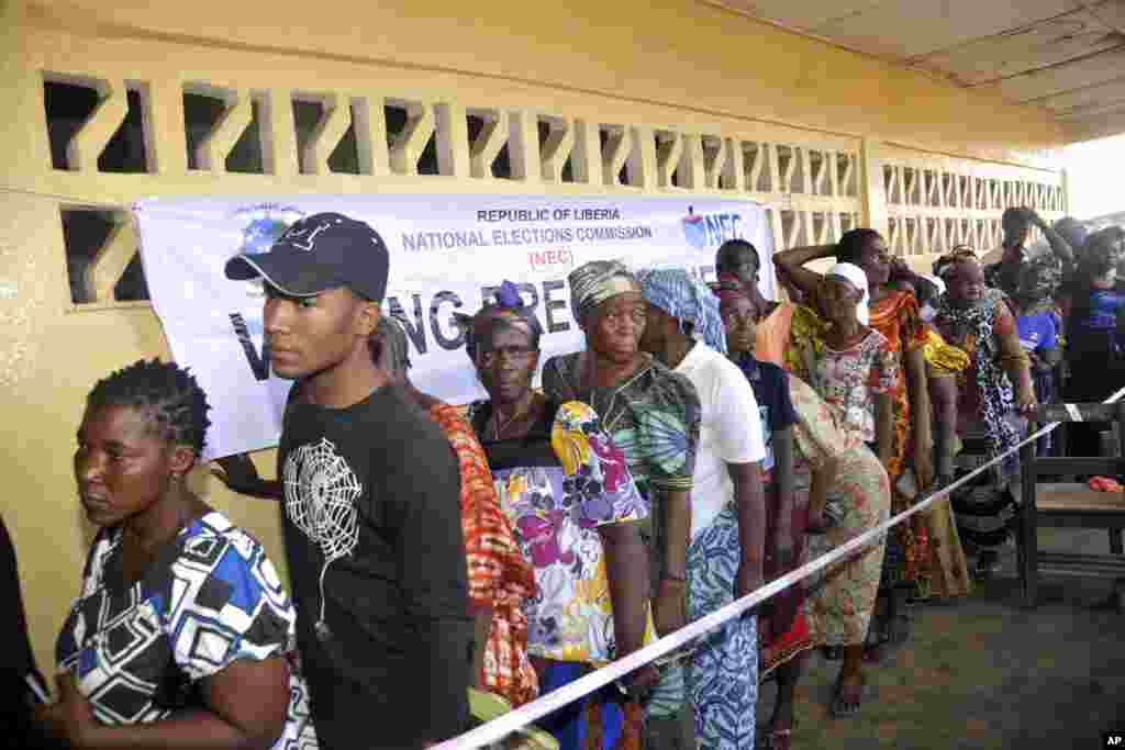 Liberians gather to vote in an election that for the first time in more than 70 years will see one democratically elected government hand power to another.