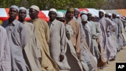 FILE - Men line up in July 2015 after being detained on suspicion of affiliation with Boko Haram.