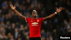 Paul Pogba jubile après la victoire de son équipe contre Manchester City 3-2 , Manchester, le 7 avril 2018.