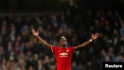 Paul Pogba jubile après la victoire de son équipe contre Manchester City 3-2, Angleterre, le 7 avril 2018.