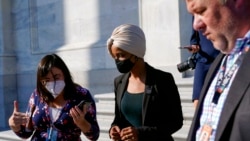 Rep. Ilhan Omar, D-Minn., center, speaks with reporters after a vote on a House continuing resolution on Capitol Hill in Washington, Sept. 30, 2021.