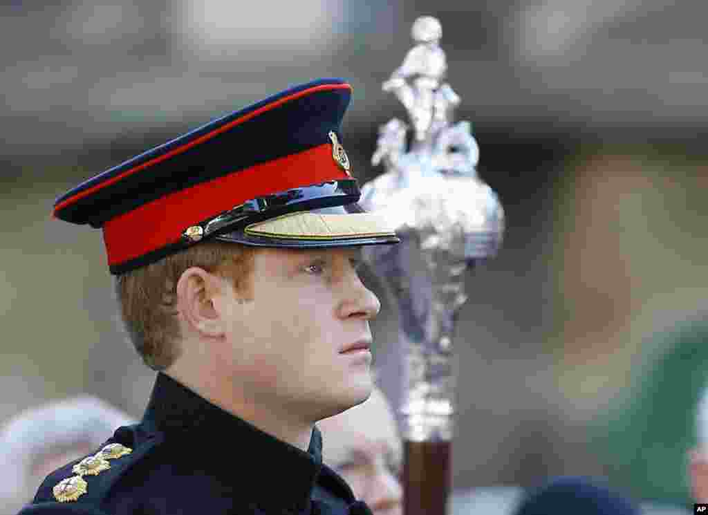 Britain's Prince Harry listens as the ‘Last Post’ sounds, ahead of a two minutes’ silence as he visited the Westminster Field of Remembrance in London.