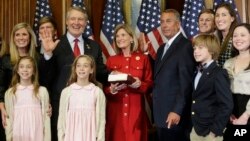 House Speaker John Boehner, right, administers the House oath to Rep. Rick Allen R-Ga., during a ceremonial re-enactment swearing-in ceremony, Jan. 6, 2015, in Washington. Allen defeated John Barrow, the last white Democrat from the Deep South. (AP Photo/Pablo Martinez Monsivais )
