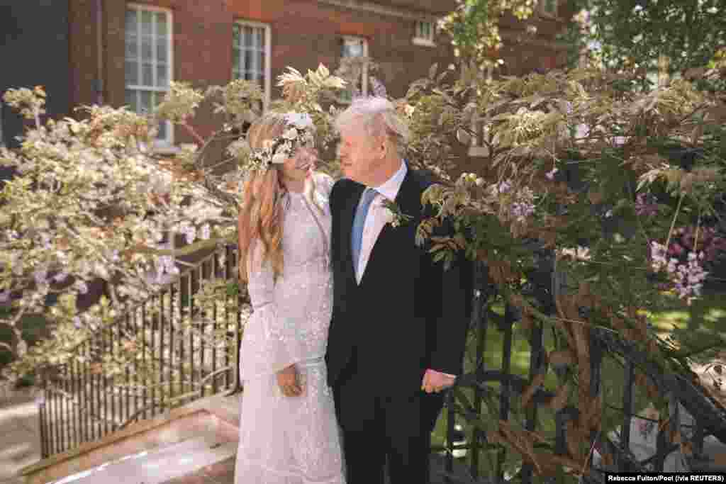 British Prime Minister Boris Johnson and his wife Carrie Johnson are seen in the garden of 10 Downing Street after their wedding in London, May 29, 2021.