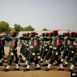 Southern Sudanese military police participate in an independence rehearsal procession in Juba, southern Sudan, July 7, 2011