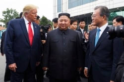 President Donald Trump meets with North Korean leader Kim Jong Un and South Korean President Moon Jae-in, right, at the border village of Panmunjom in the Demilitarized Zone, South Korea, Sunday, June 30, 2019. (AP Photo/Susan Walsh)