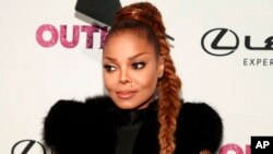 FILE - Janet Jackson attends the 22nd Annual OUT100 Celebration Gala at the Altman Building in New York, Nov. 9, 2017.