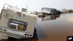 A trailer sits on the beach at the North Beach Campground after being washed out by Hurricane Irene, at Cape Hatteras National Seashore in Rodanthe, North Carolina August 29, 2011.