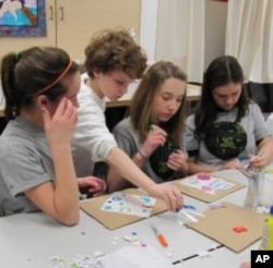 Pennsylvania students create quilt patches bearing their pledges to save the environment.