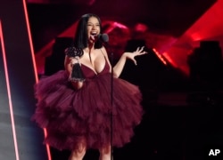 Singer Cardi B accepts the Best New Artist award during the 2018 iHeartRadio Music Awards at The Forum in Inglewood, California, March 11, 2018.