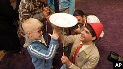A visually impaired boy learns the joy of spinning at the Big Apple Circus of the Senses.