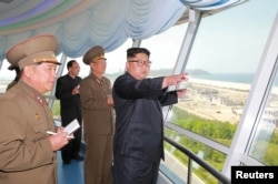 North Korean leader Kim Jong Un inspects the construction site of the Wonsan-Kalma coastal tourist area.