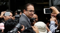 FILE - Javier Duarte, the then-governor of Veracruz state, arrives at the attorney general's office in Mexico City, Aug. 5, 2016. Duarte stepped down Oct. 12, 2016.