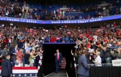U.S. President Donald Trump pumps his fist as he enters his first re-election campaign rally in several months in the midst of the coronavirus disease outbreak, at the BOK Center in Tulsa, Oklahoma, U.S., June 20, 2020. (REUTERS/Leah Millis)