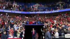 U.S. President Donald Trump pumps his fist as he enters his first re-election campaign rally in several months in the midst of the coronavirus disease outbreak, at the BOK Center in Tulsa, Oklahoma, U.S., June 20, 2020. (REUTERS/Leah Millis)