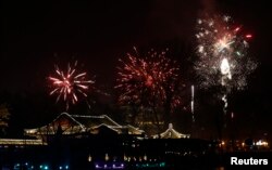 Fireworks explode over the Houhai lake as residents celebrate the start of the Chinese New Year in Beijing February 9, 2013. The Lunar New Year, or Spring Festival, begins on February 10 and marks the start of the Year of the Snake, according to the Chine