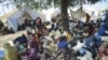 Residents gather outside United Nations Mission in Sudan sector headquarters, where as many as 40,000 people have fled fighting in the region, in Kadugli town, capital city of South Kurdufan State, Sudan, June 9, 2011 (file photo)