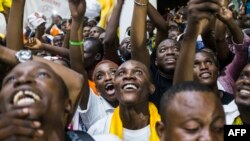 Supporters of newly re-elected Congo President Denis Sassou Nguesso celebrate his victory in Brazzaville on March 24, 2016 after the Independent Electoral Commission declared him the winner.