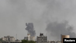 Smoke billows from the site of Saudi-led airstrikes on al-Dailami air base in Yemen's capital, Sana'a, Sept. 6, 2015. 