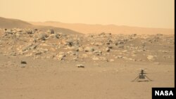 This file photo, captured by NASA's Perseverance rover, shows the Ingenuity helicopter on the surface of Mars. The image was received on June 15, 2021. (Credit: NASA/JPL-Caltech/ASU)