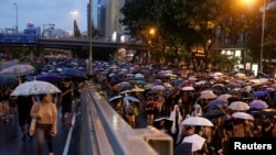 Demonstran anti RUU ekstradisi menuntut demokrasi dan reformasi politik, di Hong Kong, China, 18 Agustus 2019. (Reuters)