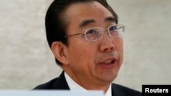 Wu Hailong, special envoy of China's foreign ministry, addresses the Human Rights Council Universal Periodic Review session at the United Nations in Geneva on October 22, 2013. 