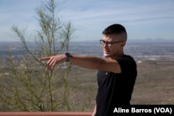Ian Valdez, a 22-year-old El Paso resident and registered Republican, points to the direction of a nearby port of entry in the U.S. side.