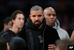 Rapper Drake attends an NBA basketball game between the Los Angeles Lakers and the Oklahoma City Thunder, Dec. 23, 2015, in Los Angeles.