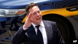 FILE - Tesla CEO Elon Musk, one of the richest people in the world, asked his Twitter followers Saturday, Nov. 6, 2021, if he should sell 10 percent of his Tesla shares. (AP Photo/Matt Rourke, file) 